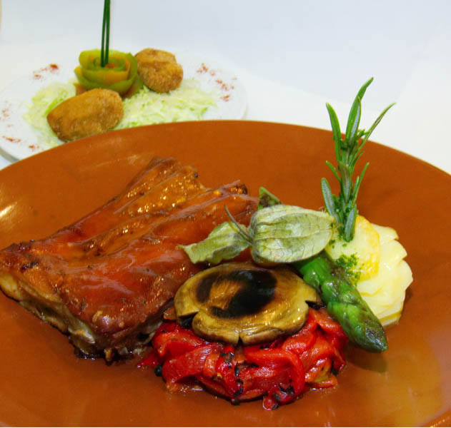 Imagen del plato que va a proponer La Buganvilla, que consiste en un Cochinillo de Segovia asado a la antigua.